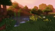 A quiet forest by the water rendered in Sildur's Vibrant Shaders (Image via Sildur/Minecraftshader.com)